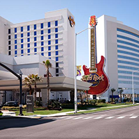 Exterior view of Hard Rock Casino Biloxi showcasing the iconic guitar themed hotel design and beachfront location highlighting a premier casino music and entertainment destination on the Mississippi Gulf Coast.