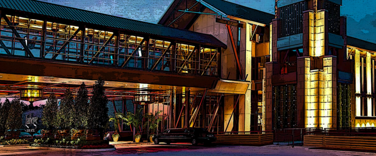 LAuberge Casino and Hotel Baton Rouge exterior along the Mississippi River featuring the resort and event venue for concerts and live entertainment